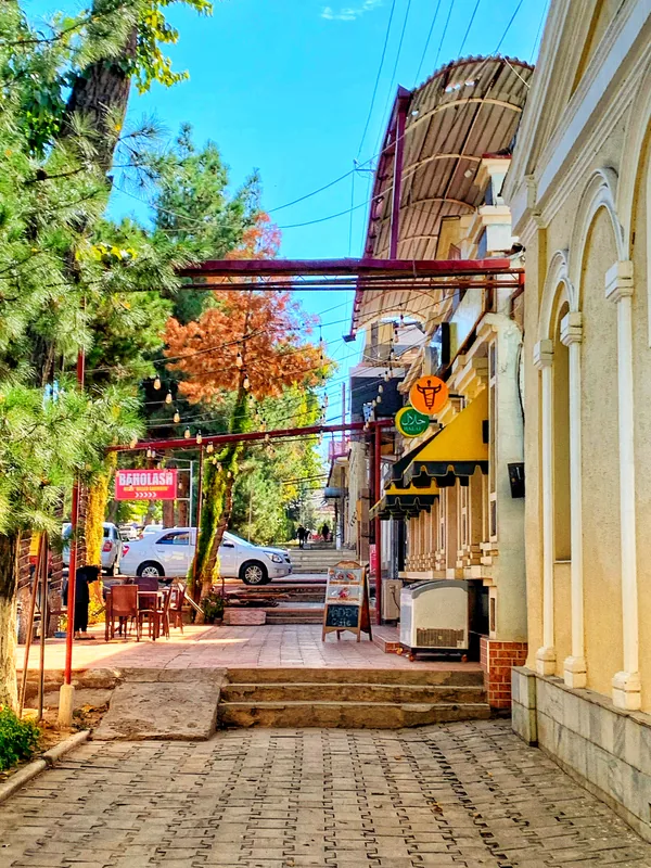 Quiet street with trees and balconies